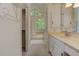 Bright bathroom featuring a double vanity, tub, and shower at 4259 Arbor Club Dr, Marietta, GA 30066
