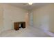 This carpeted bedroom offers neutral walls, a ceiling fan with lights, and two closets at 4259 Arbor Club Dr, Marietta, GA 30066