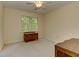 This bedroom boasts a large window offering natural light and forest views at 4259 Arbor Club Dr, Marietta, GA 30066
