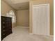 Bright bedroom features neutral walls and carpet, a closet, and a window at 4259 Arbor Club Dr, Marietta, GA 30066