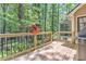 Spacious outdoor deck showcasing a wooden railing and a vibrant flower pot adding a touch of color at 4259 Arbor Club Dr, Marietta, GA 30066