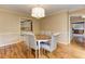 Hardwood-floored dining room with view to the kitchen and other areas of the house at 4259 Arbor Club Dr, Marietta, GA 30066