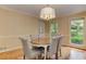 Dining room with hardwood floors, a view to the outside and a table and chairs for a comfortable meal at 4259 Arbor Club Dr, Marietta, GA 30066