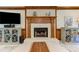 Bright living room enhanced by fireplace and cabinets with decorative trim and a neutral color palette at 4259 Arbor Club Dr, Marietta, GA 30066