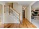 Inviting foyer features hardwood floors, a staircase with white risers, and views into a spacious living area at 4259 Arbor Club Dr, Marietta, GA 30066
