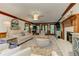 Warm living room with fireplace, couch, chairs, wood trim, and an open layout that is great for entertaining at 4259 Arbor Club Dr, Marietta, GA 30066