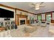 Comfortable living room showcasing a fireplace, television, bright windows and decoratively appointed with cabinets and chairs at 4259 Arbor Club Dr, Marietta, GA 30066