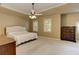 Comfortable main bedroom with tray ceiling, ceiling fan and two windows at 4259 Arbor Club Dr, Marietta, GA 30066