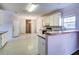 Kitchen with white cabinets, a breakfast bar, and linoleum floor at 1728 Brandon Lee Sw Way, Marietta, GA 30008