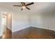 Large living room with hardwood floors, ceiling fan, and neutral walls at 2287 Titan Dr, Decatur, GA 30035