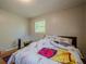 Modest bedroom with neutral walls, wood floors, natural light and floral bedding at 3710 Lynn Dr # A & B, Powder Springs, GA 30127
