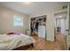 Bright bedroom features hardwood floors, a window with blinds, and a closet with storage at 3710 Lynn Dr # A & B, Powder Springs, GA 30127