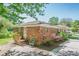 Side view of a brick home with a wooden deck and lush greenery at 3710 Lynn Dr # A & B, Powder Springs, GA 30127