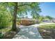 Brick home with a long driveway, mature trees, and well-kept lawn at 3710 Lynn Dr # A & B, Powder Springs, GA 30127