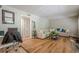 Spacious living room featuring hardwood floors, neutral paint, comfortable couch, and view of doorway at 3710 Lynn Dr # A & B, Powder Springs, GA 30127