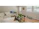 Cozy living room with hardwood floors, comfortable seating, natural light, and access to the backyard at 3710 Lynn Dr # A & B, Powder Springs, GA 30127