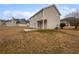 Spacious backyard with a patio and grassy area at 7085 Magnolia Ln, Fairburn, GA 30213