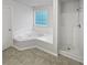 Main bathroom with corner jacuzzi tub and shower at 7085 Magnolia Ln, Fairburn, GA 30213