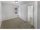 Bedroom with access to bathroom and window at 7085 Magnolia Ln, Fairburn, GA 30213