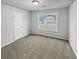 Cozy bedroom with neutral carpet and large window at 7085 Magnolia Ln, Fairburn, GA 30213