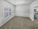 Bright dining room with tile flooring and wainscoting at 7085 Magnolia Ln, Fairburn, GA 30213