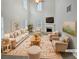 Spacious living room with high ceilings, fireplace, and neutral decor at 7085 Magnolia Ln, Fairburn, GA 30213
