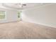 Large bedroom with ceiling fan and neutral carpet at 175 Regency Pl, Covington, GA 30016