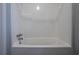 A clean and bright bathroom with a tub and shower combination offers a functional space at 180 Sears Cir, Covington, GA 30016