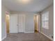 Bedroom featuring neutral paint, carpet and a closet for storage at 180 Sears Cir, Covington, GA 30016