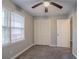 A carpeted bedroom with a large window offers a comfortable space and ample natural light at 180 Sears Cir, Covington, GA 30016