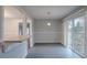 A dining area with a sliding glass door and updated flooring is perfect for meals and gatherings at 180 Sears Cir, Covington, GA 30016