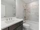 Contemporary bathroom featuring a tub, toilet, a marble tiled shower and vanity with quartz counters at 413 Nettle Ct, Woodstock, GA 30189