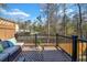 Outdoor deck space with stylish outdoor furniture and a view of trees at 6369 Queens Court Trce, Mableton, GA 30126