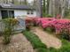 Landscaped backyard with azaleas and deck at 75 Azalea Trl, Carrollton, GA 30116