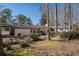 Large backyard with mature trees and patio at 75 Azalea Trl, Carrollton, GA 30116