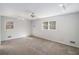 Large bedroom with neutral walls and carpet at 75 Azalea Trl, Carrollton, GA 30116