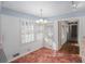 Bright dining area with hardwood floors and blue wallpaper at 75 Azalea Trl, Carrollton, GA 30116