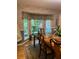 Bright dining room with bay window, stained glass, and wood table at 75 Azalea Trl, Carrollton, GA 30116