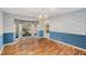 Dining room features hardwood floors and a bay window at 75 Azalea Trl, Carrollton, GA 30116