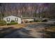 Ranch house with white brick exterior and landscaping at 75 Azalea Trl, Carrollton, GA 30116