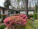 White brick house with blooming azaleas in the front yard at 75 Azalea Trl, Carrollton, GA 30116