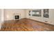 Spacious living room featuring hardwood floors and a fireplace at 75 Azalea Trl, Carrollton, GA 30116