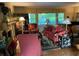 Living room with fireplace, red accents, and hardwood floors at 75 Azalea Trl, Carrollton, GA 30116