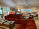 Living room with red couches, wood fireplace, and high ceiling at 75 Azalea Trl, Carrollton, GA 30116