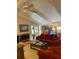 Living room with red couches, wood fireplace, and high ceiling at 75 Azalea Trl, Carrollton, GA 30116