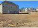Large backyard with view of neighboring homes at 1455 Weeping Tree Cir, Auburn, GA 30011