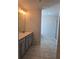 Double vanity bathroom with gray cabinets and a large mirror at 1455 Weeping Tree Cir, Auburn, GA 30011