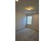 Well-lit bedroom with carpet and window coverings at 1455 Weeping Tree Cir, Auburn, GA 30011