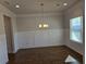 Spacious dining room with hardwood floors and wainscoting at 1455 Weeping Tree Cir, Auburn, GA 30011