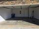 Spacious garage with concrete floor and access door at 1455 Weeping Tree Cir, Auburn, GA 30011